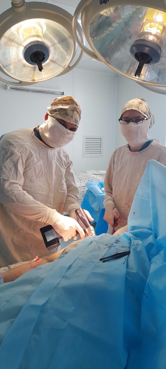 Dr. Anil Sharma performing treatment in an operating room